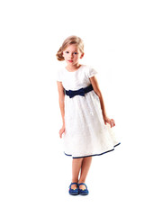 Pretty blondie six years old small girl on white background in white prom dress full height