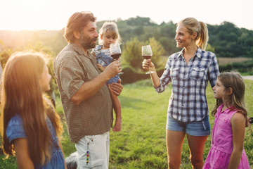 Winemaker family together in vineyard