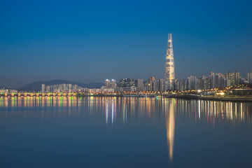 Fototapeta na wymiar Night Cityscape at Han River, Seoul City, The view from Cheongdam Road Park in Seoul, South Korea.