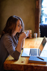 Young woman drinking coffee