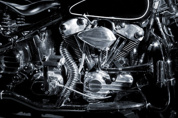 Details of retro engine on black background.