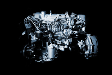 Fototapeta premium Details of engine close up on black background.