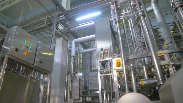 Pipes in a industrial factory. Chemical, gas, oil, waterbio gas pipes 4K