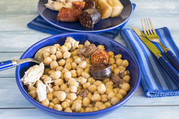 Madrid stew, typical Spanish dish with chickpeas, vegetables and meat,