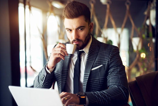 Businessman drinking coffee.