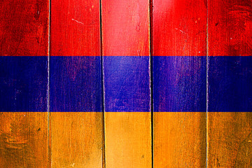 Vintage Armenia  flag on grunge wooden panel