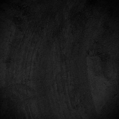 dark surface of the cement plaster wall.