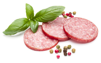 Salami smoked sausage three slices, basil leaves and peppercorns