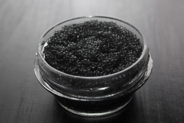 Fototapeta na wymiar black caviar on a black background