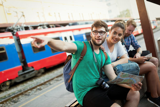 Young tourists travelling by train