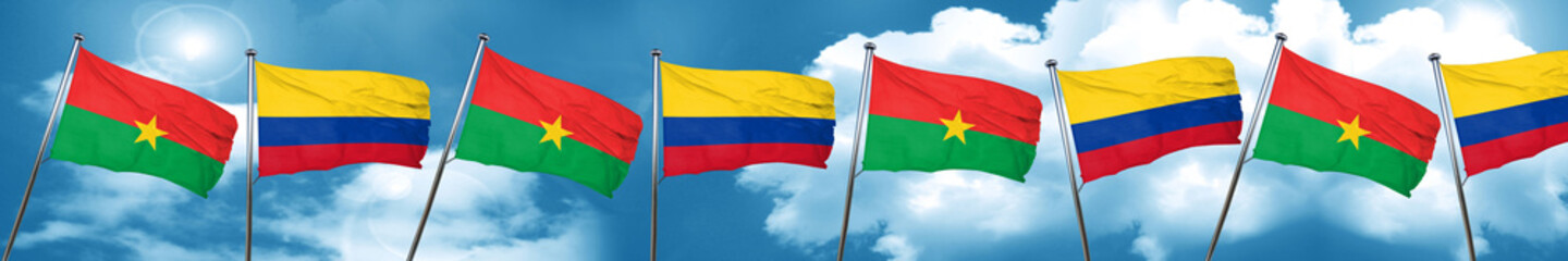 Burkina Faso flag with Colombia flag, 3D rendering