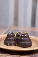 Chocolate cream cakes on the plate