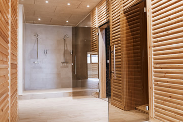 Spa resort hallway with saunas and shower