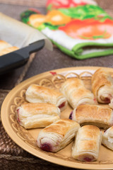 Cherry cream puff pastry served on the plate