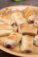 Cherry cream puff pastry served on the plate