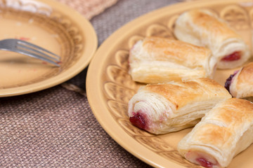 Cherry cream puff pastry served on the plate
