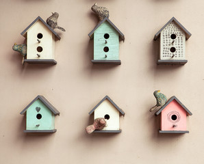 many small bright bird houses, spring background - 135740004