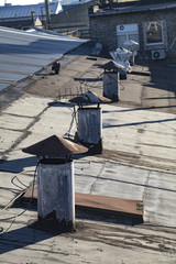 Chimneys on the roof of an old industrial facility