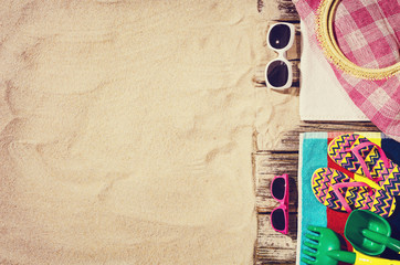 Top view of sandy beach frame. Background with copy space and visible sand texture.