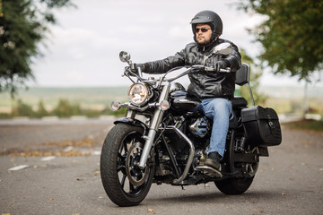 Obraz na płótnie Canvas Biker man with motorcycle