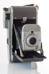 Gray vintage camera on white background