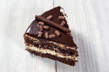 chocolate cake with Candied Oranges,Chocolate cake with a cut piece and blade on gray background, closeup,Dark chocolate cake,Delicious vegan chocolate cake,Tasty chocolate cake on wooden background