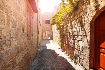 Fototapeta na wymiar Ancient narrow street of medieval old town, Rhodes
