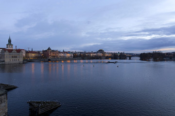Obraz premium Evening Prague City above River Vltava after sunset from Charles Bridge, Czech Republic