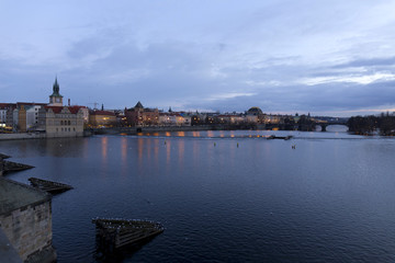 Fototapeta na wymiar Evening Prague City above River Vltava after sunset from Charles Bridge, Czech Republic
