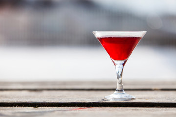 Red cocktail in the glass