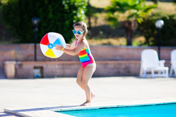 Child in swimming pool on summer vacation