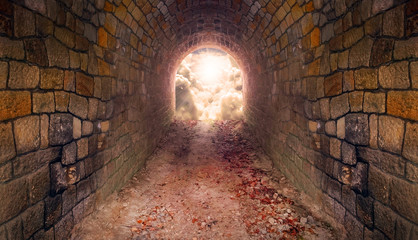 Light at end of the tunnel. Way to freedom or to heaven. Opened door from underground or grave. Hope metaphor. © Kletr