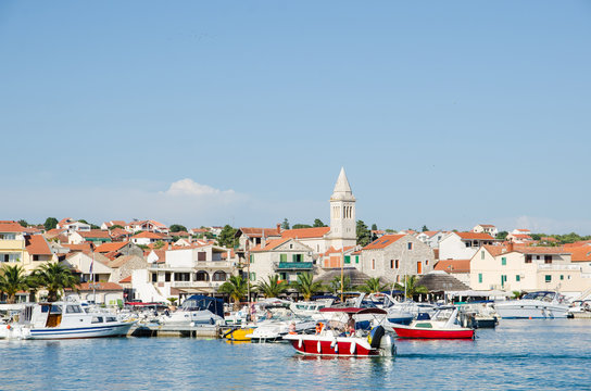 Summer view of Pakostane harbor waterfront in Dalmatia, Croatia.