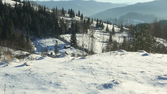 Panoramic shot of winter mountains at sunny day.