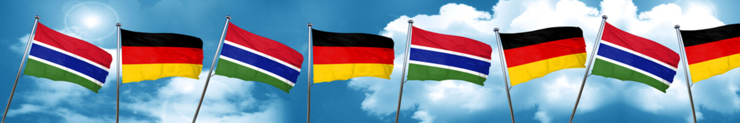 Gambia flag with Germany flag, 3D rendering