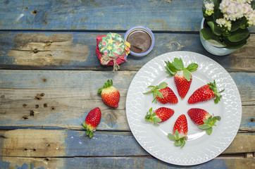 Fresh strawberries on white plate