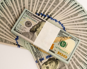 Stack of money in US dollars cash banknotes
