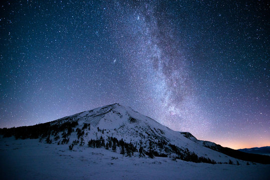 Milky Way over the snowy peaks of the Carpathian Mountains
