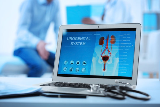 Medical concept. Laptop with urology image on doctor's desk