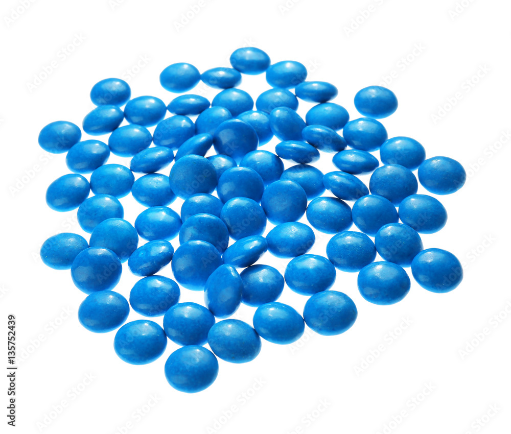 Wall mural Blue candies on white background