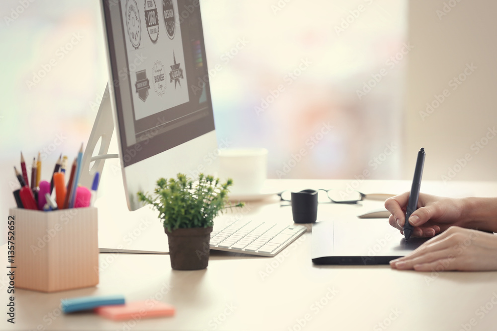 Canvas Prints Female hands using graphic tablet in office