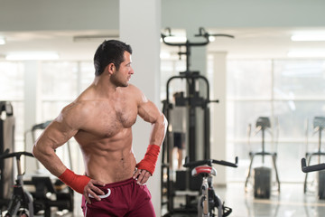 Shirtless Muscular Boxer With Gloves In Gym