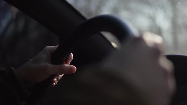 Hands of a man driving a car in 4k
