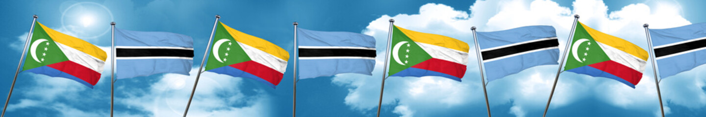 Comoros flag with Botswana flag, 3D rendering