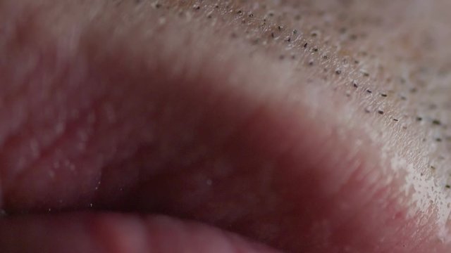 Closeup shot of a young adults pink lips