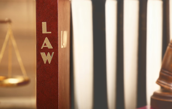 Law books standing in row, closeup
