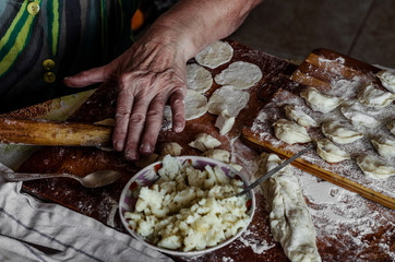 mature hands make dough dumplings