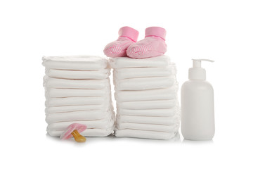 Baby diapers and necessities on white background