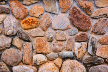 background and texture of granite stone wall surface.