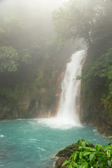Fototapeta na wymiar Rio celeste waterfall at foggy day
